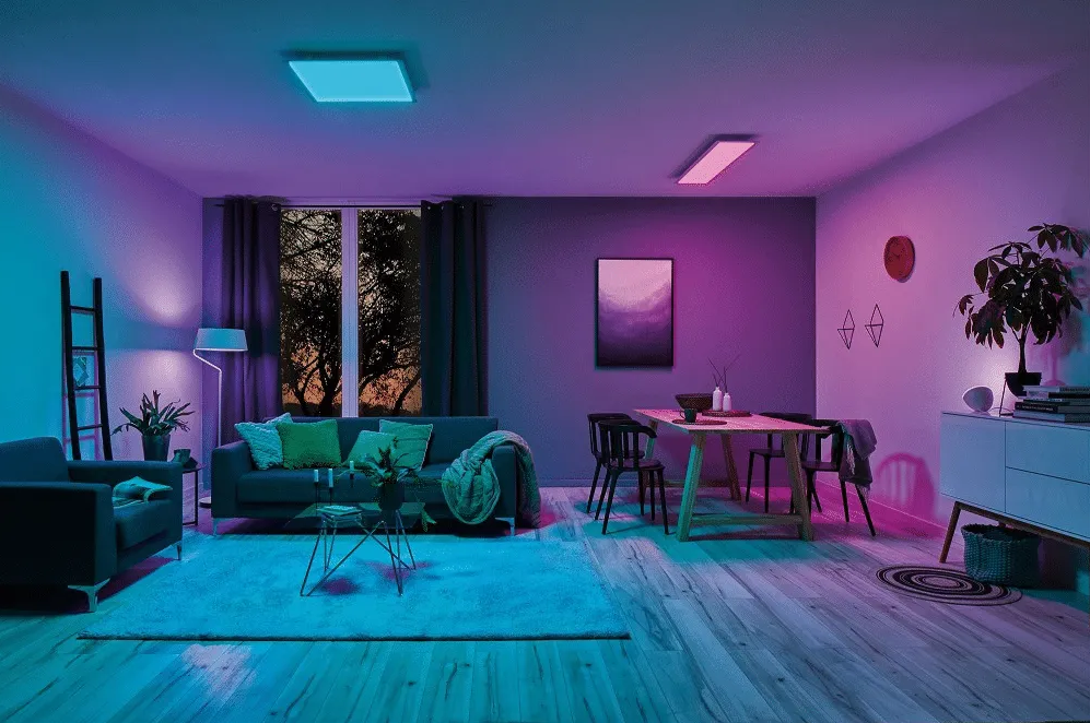 A gaming space illuminated by a smart bulb-controlled lamp, showcasing adjustable colors and brightness for a personalized ambiance.